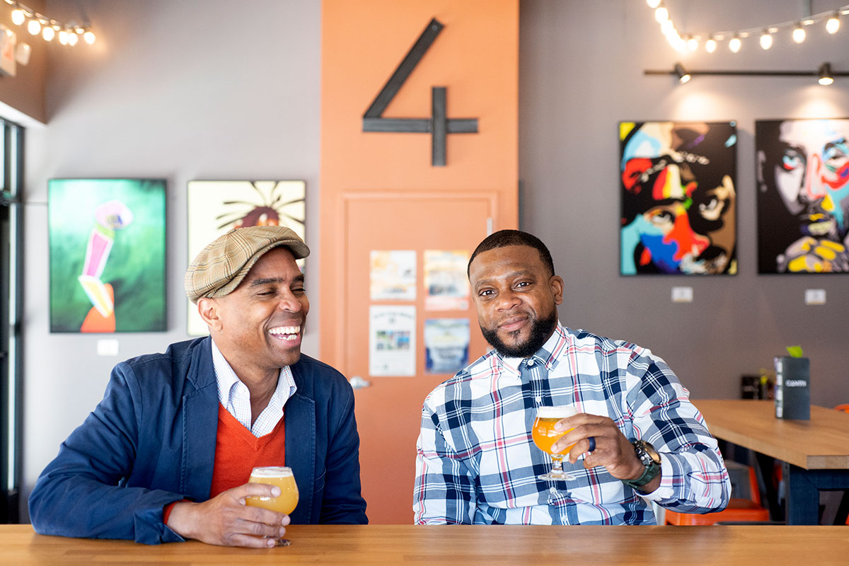 men enjoying beer in artful brewery