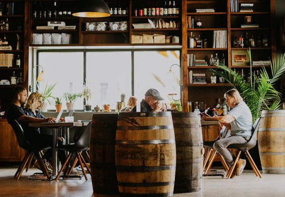 moody brewery and coffee shop interior with patrons working